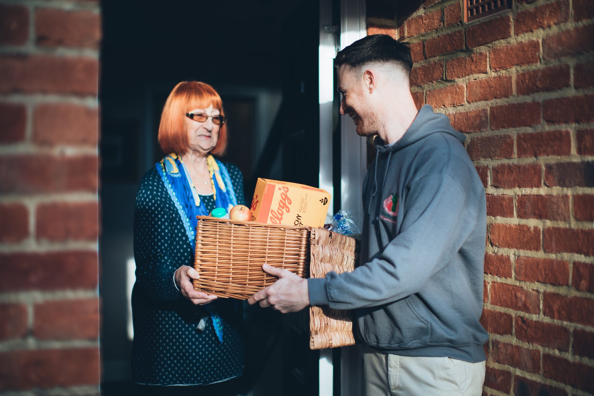 Person delivering a food basket