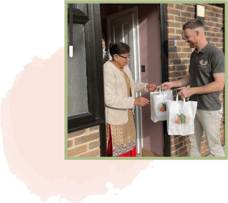 Person receiving bags of food